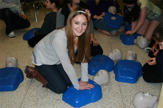 Girl giving cpr, girl cpr training, teenage girl cpr training, teenage girl cpr training dummy, Teens For Life in training