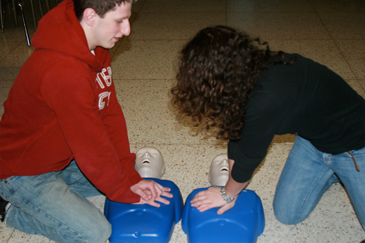 Teens practicing cpr, boy and girl cpr training, cpr dummies teenage boy and girl, Teens For Life in training